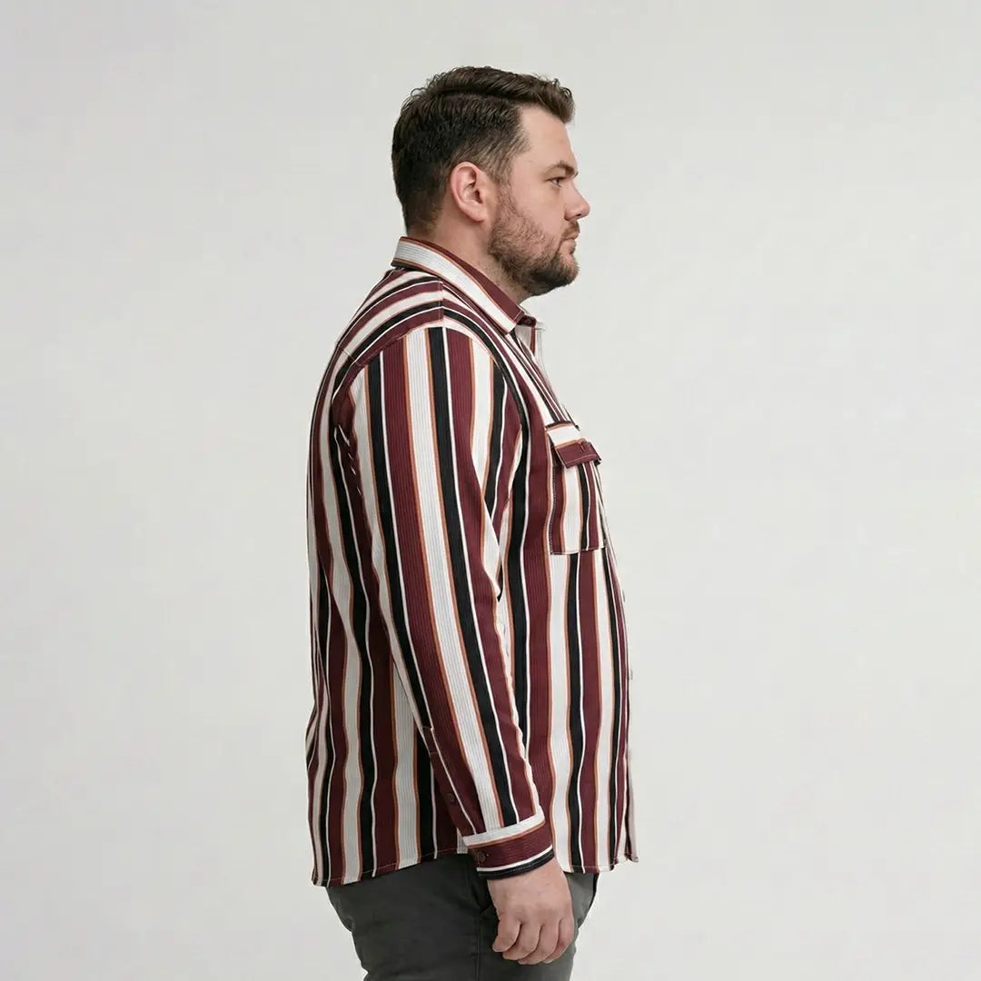 Man wearing a striped shirt against a plain background