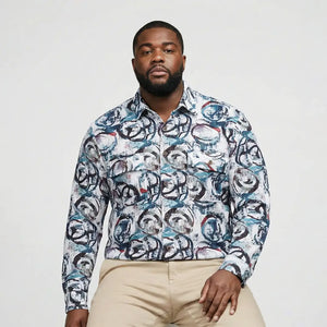 Man wearing a patterned shirt with a plain background