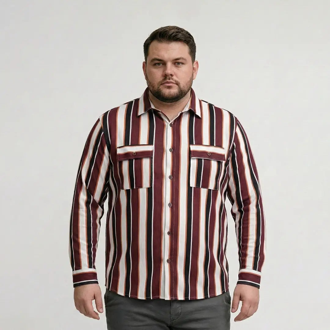 Man wearing a striped shirt against a plain background