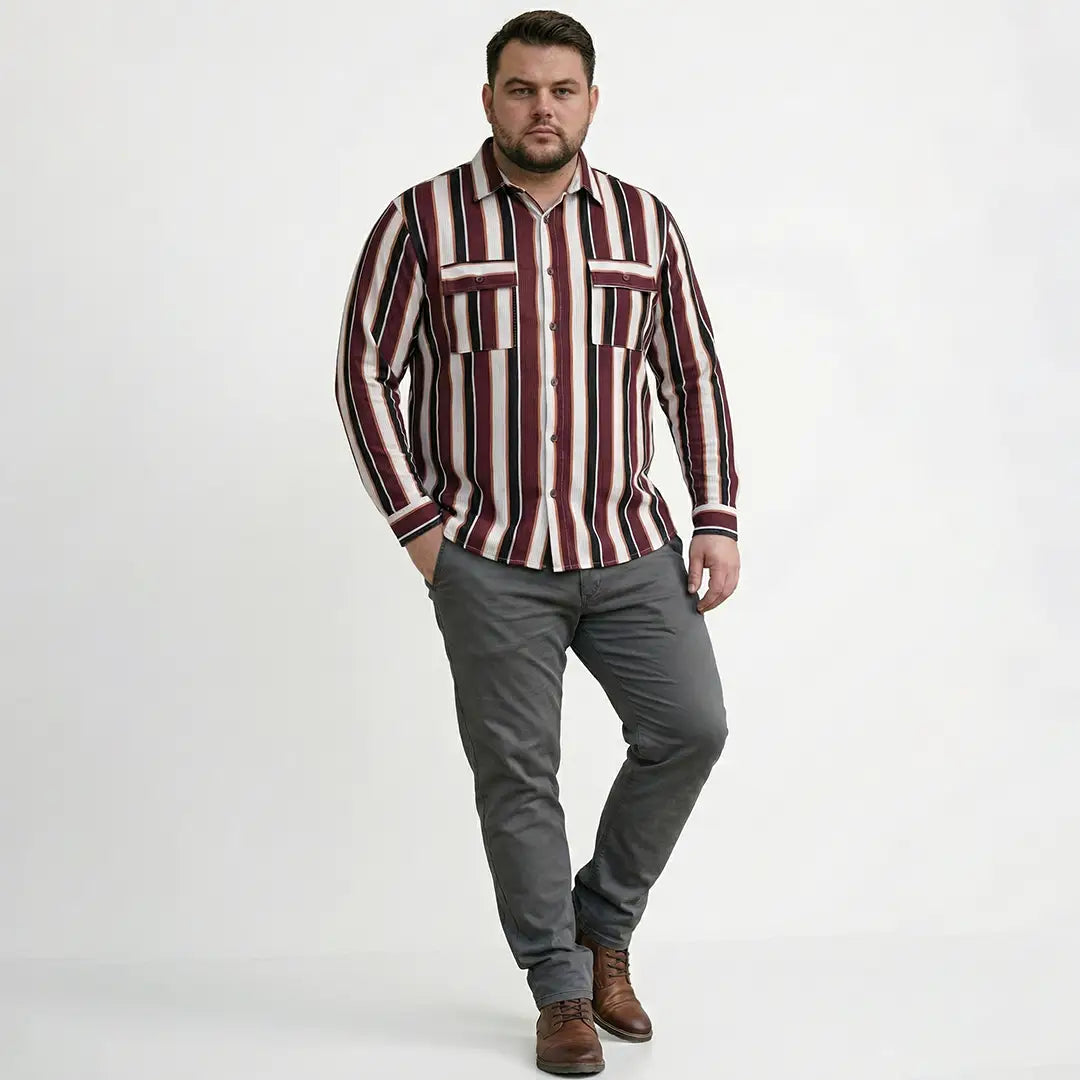 Man wearing a striped shirt and gray pants on a white background