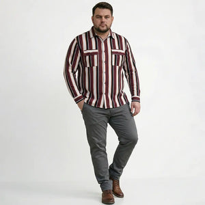 Man wearing a striped shirt and gray pants on a white background