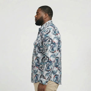 Man wearing a patterned shirt on a plain background