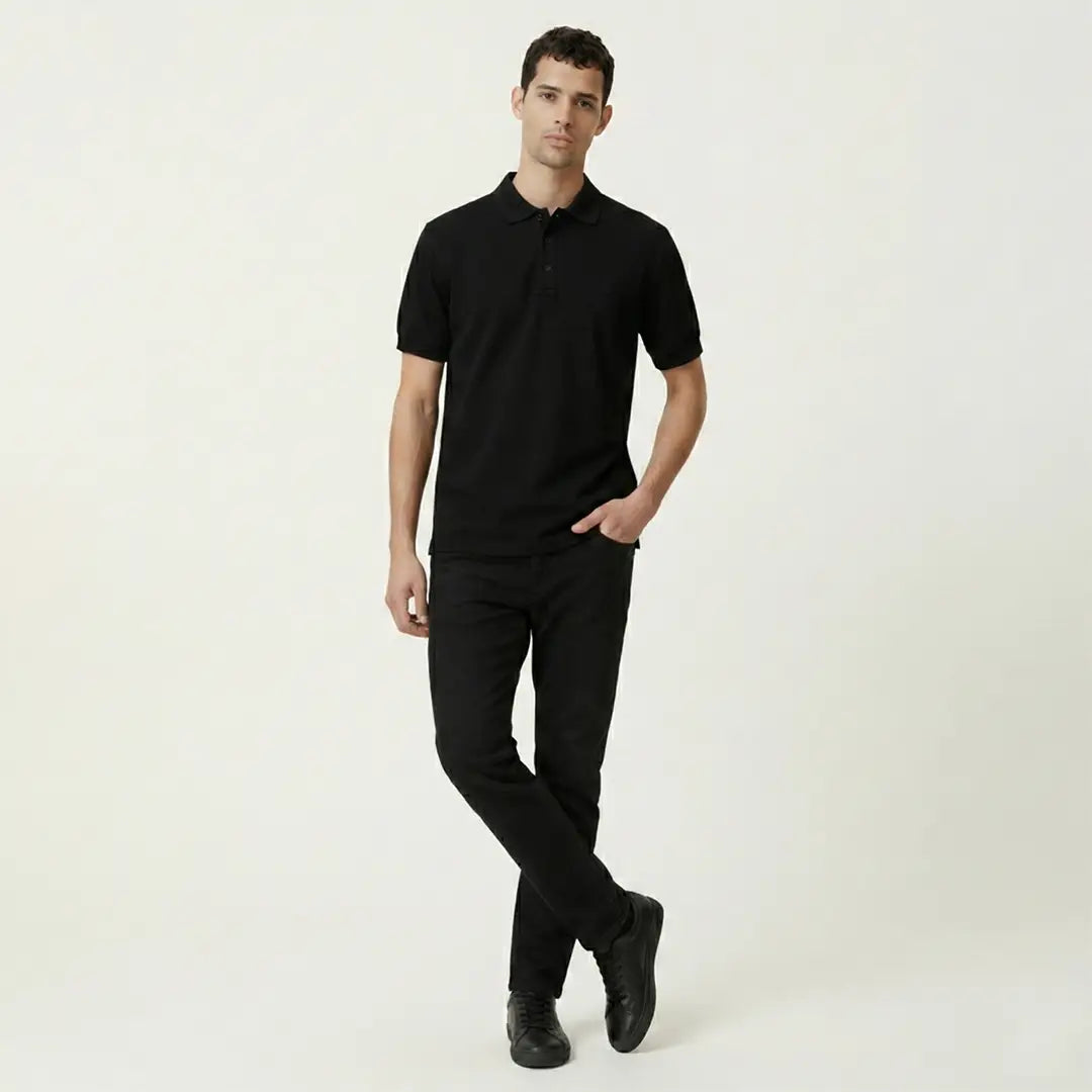 Man wearing a black polo shirt and pants on a white background